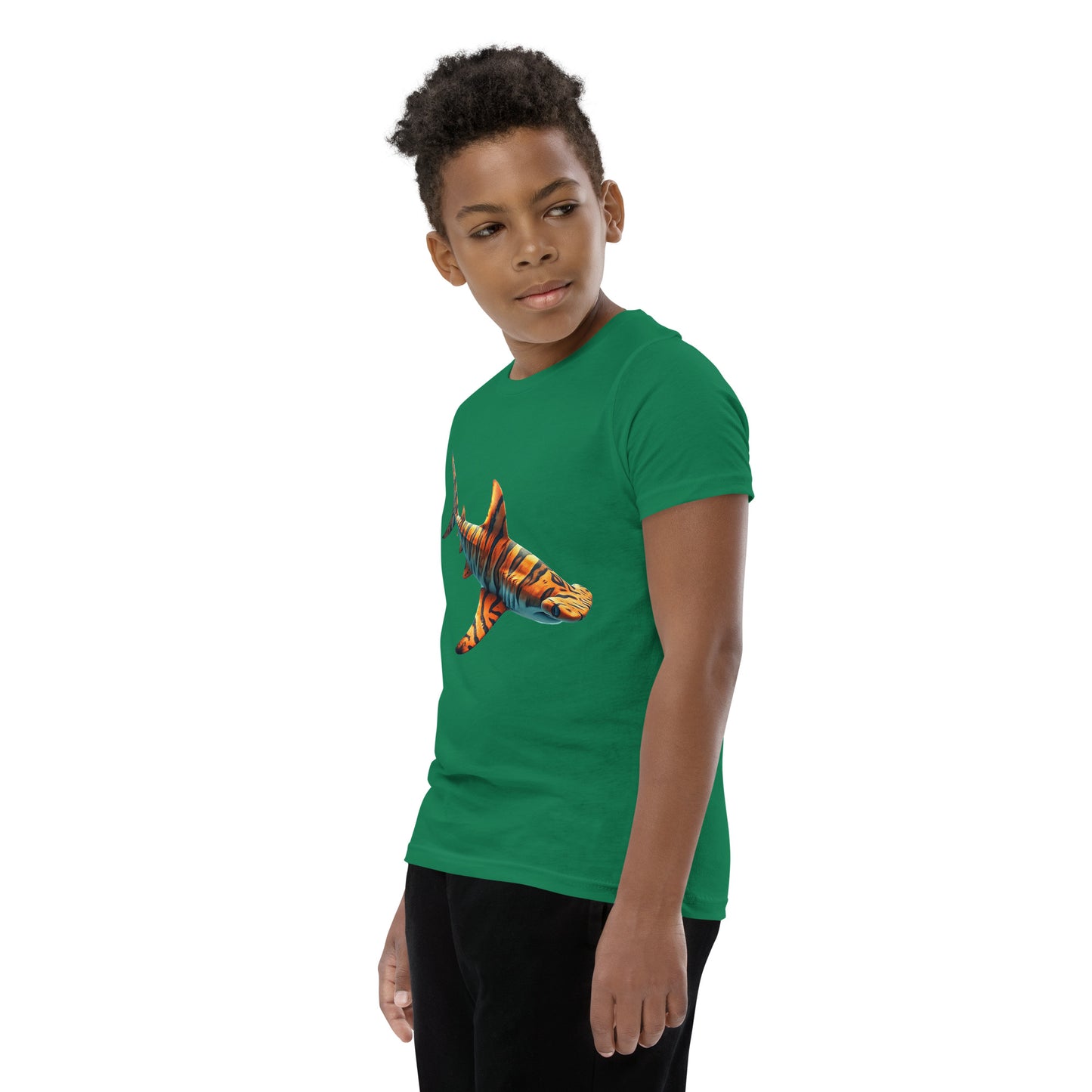 Youth with a green T-shirt and print of a hammerhead sharp