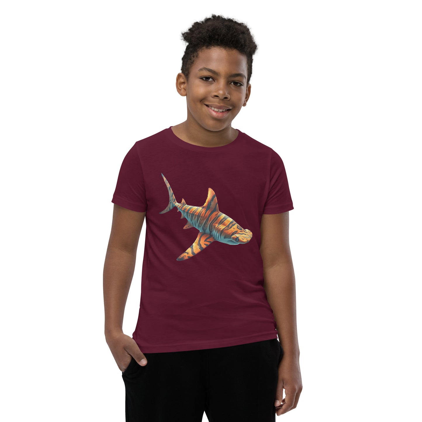 Youth with a maroon T-shirt and print of a hammerhead sharp
