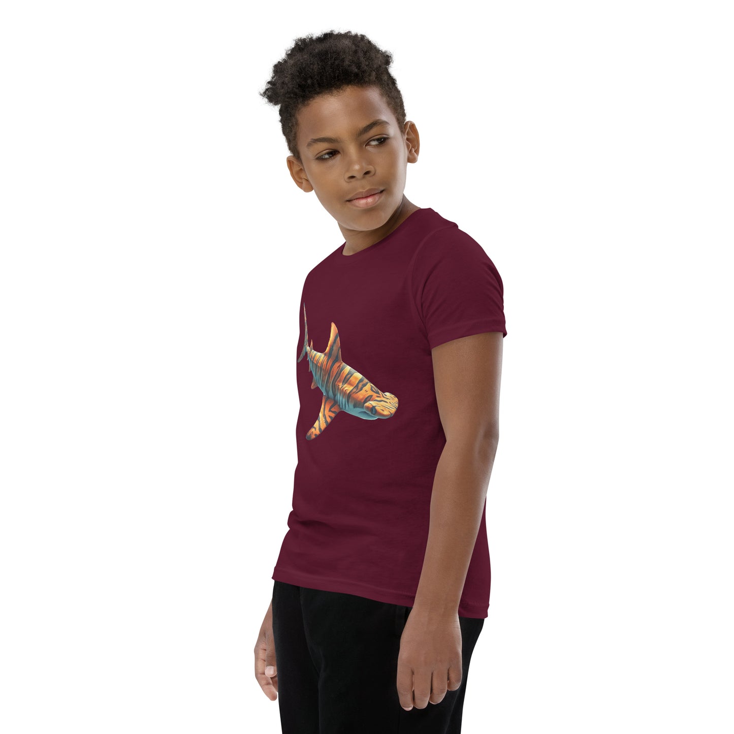 Youth with a maroon T-shirt and print of a hammerhead sharp