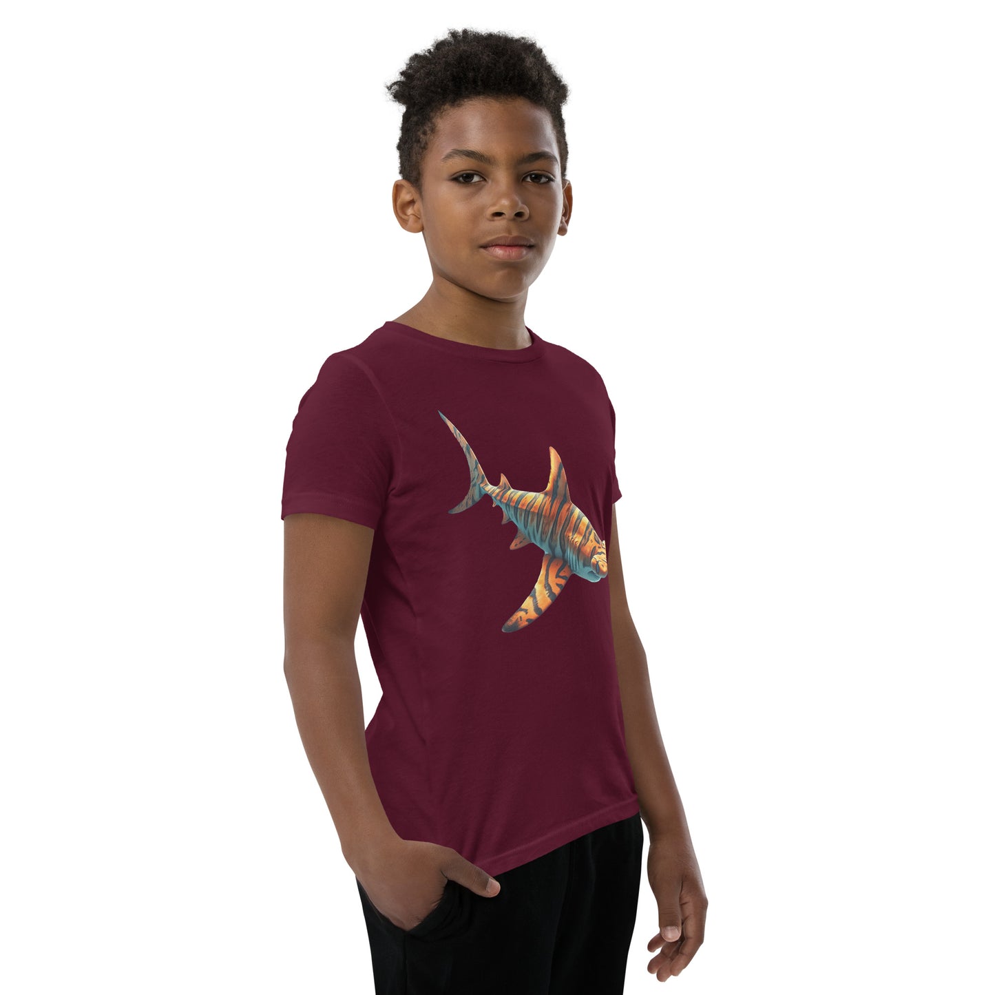 Youth with a maroon T-shirt and print of a hammerhead sharp