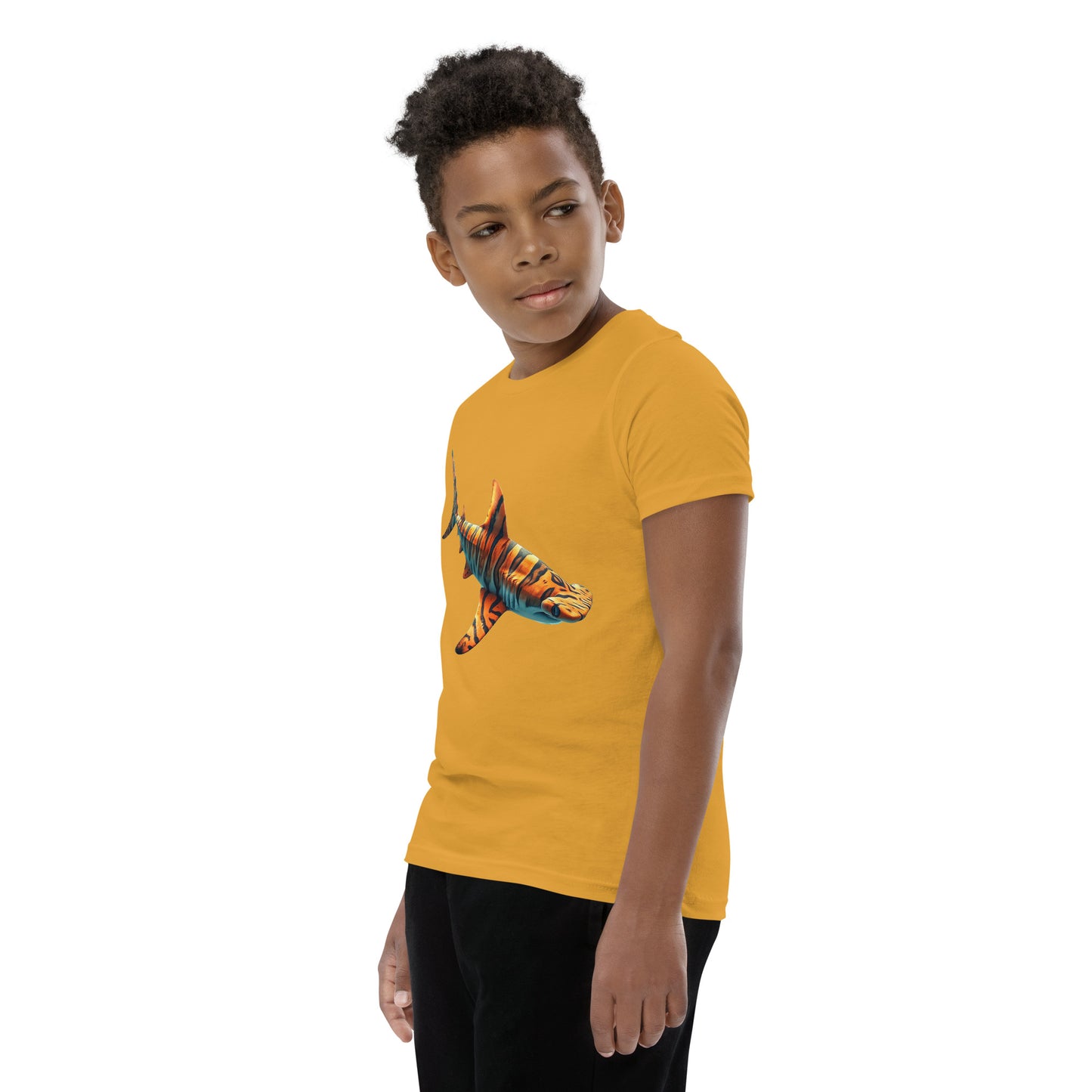 Youth with a mustard T-shirt and print of a hammerhead sharp