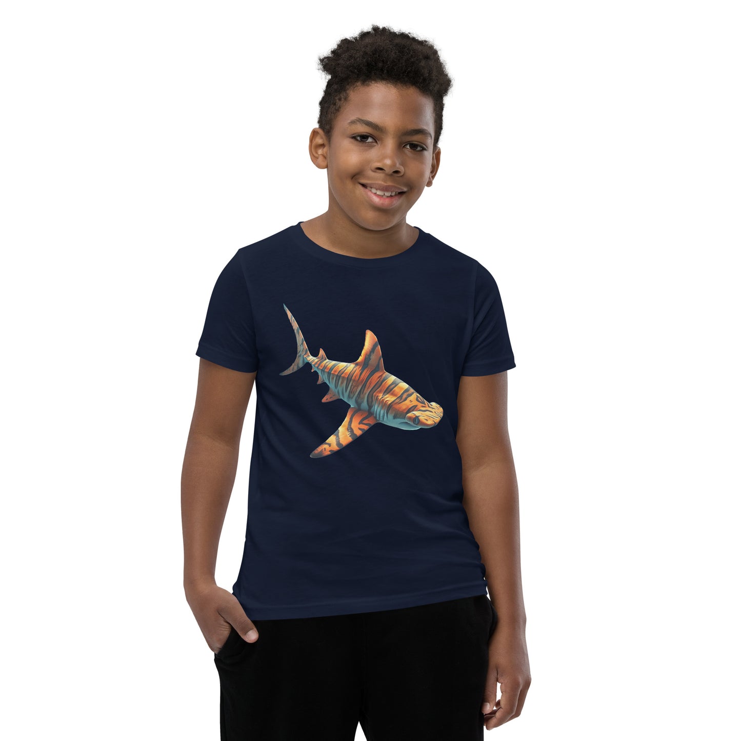 Youth with a navy T-shirt and print of a hammerhead sharp