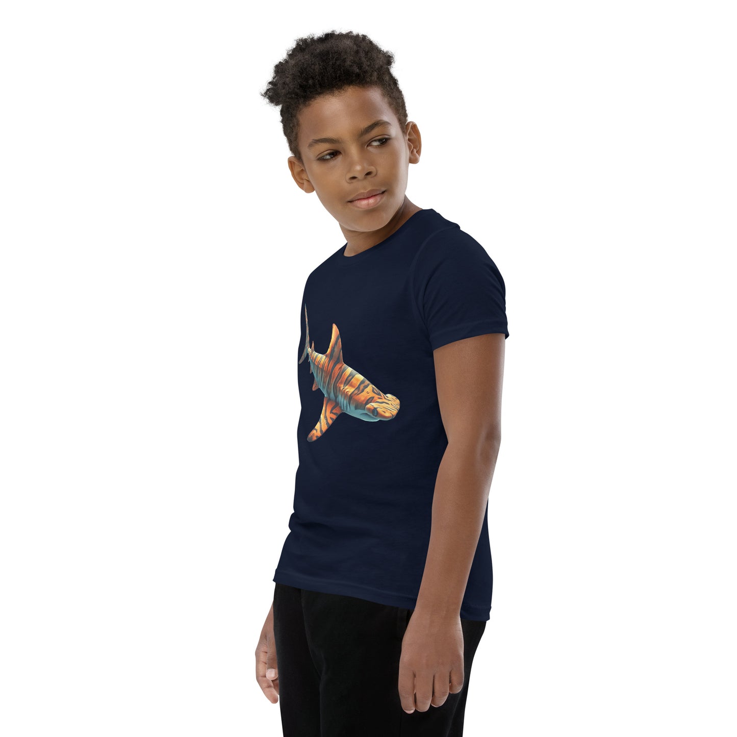 Youth with a navy T-shirt and print of a hammerhead sharp