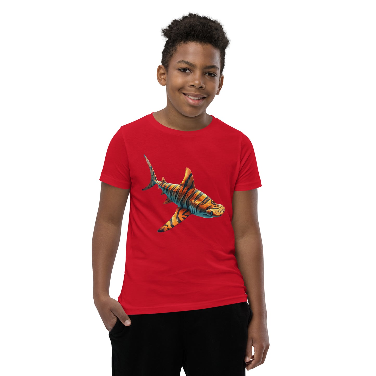 Youth with a red T-shirt and print of a hammerhead sharp