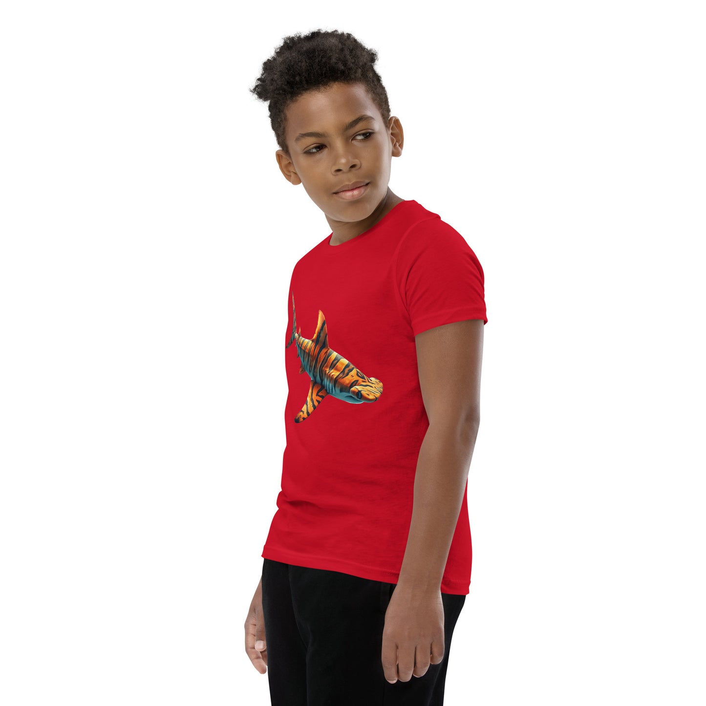 Youth with a red T-shirt and print of a hammerhead sharp