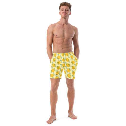 Men with yellow swim trunk and print of pineapples on it