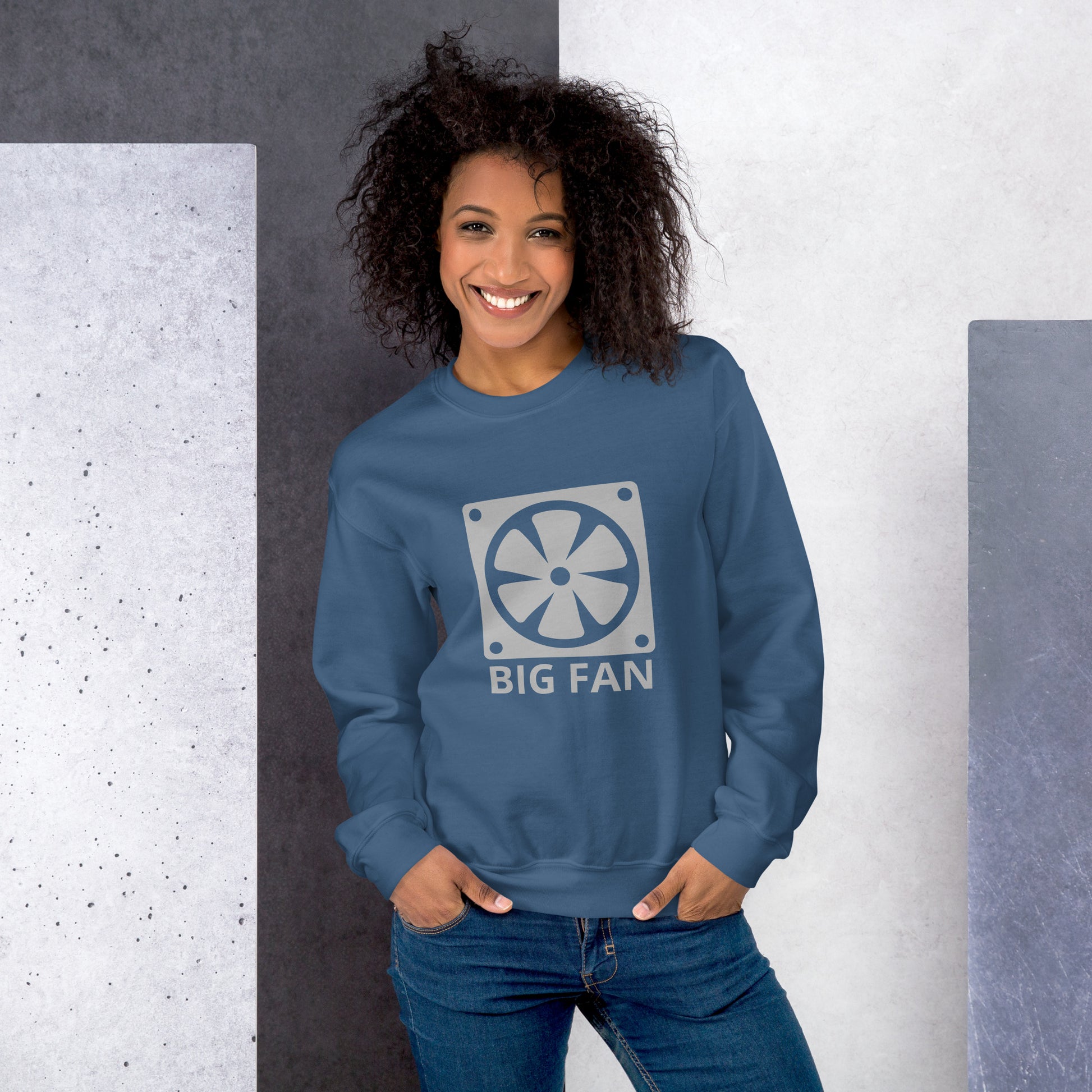 Women with indigo blue sweatshirt with image of a big computer fan and the text "BIG FAN"