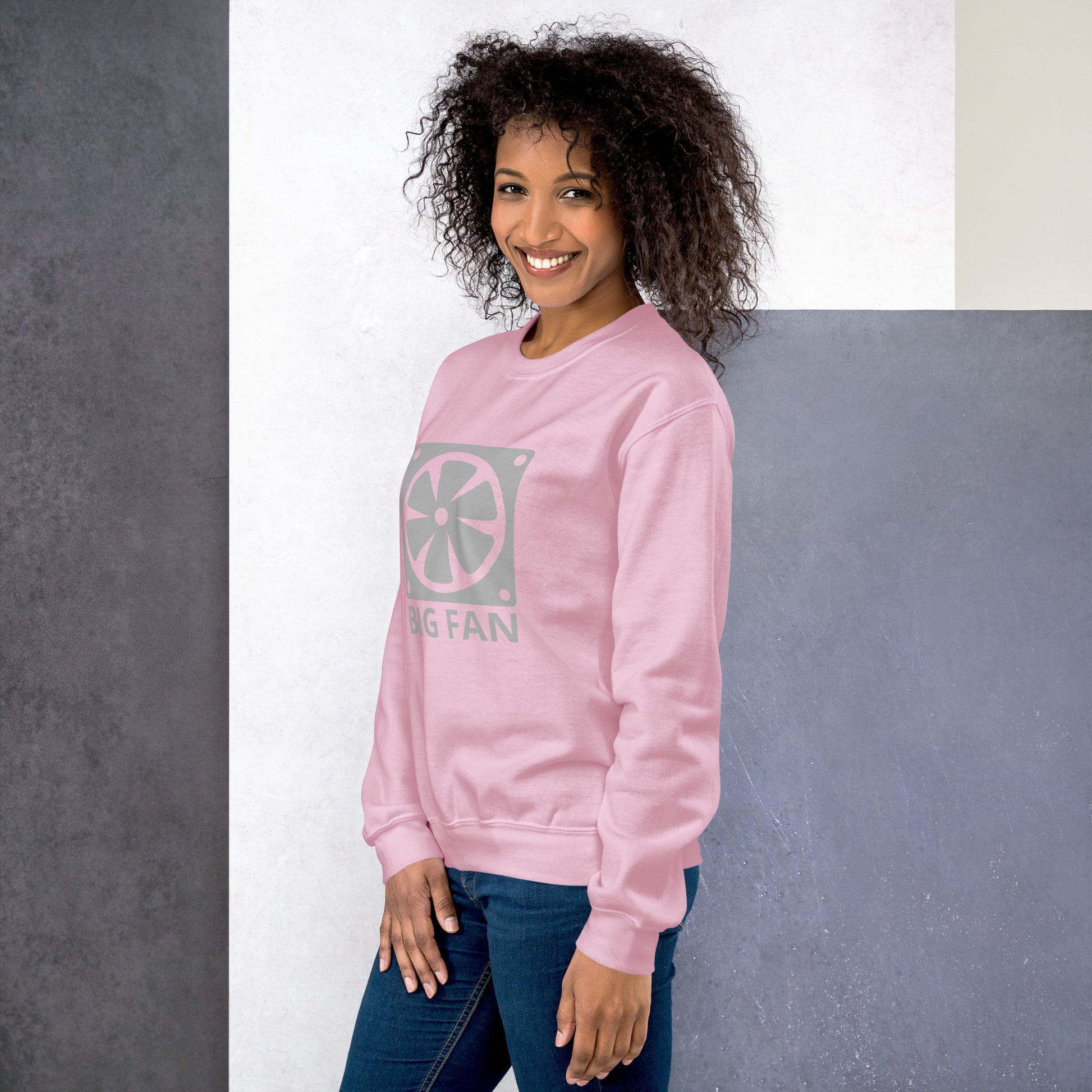 Women with pink sweatshirt with image of a big computer fan and the text "BIG FAN"