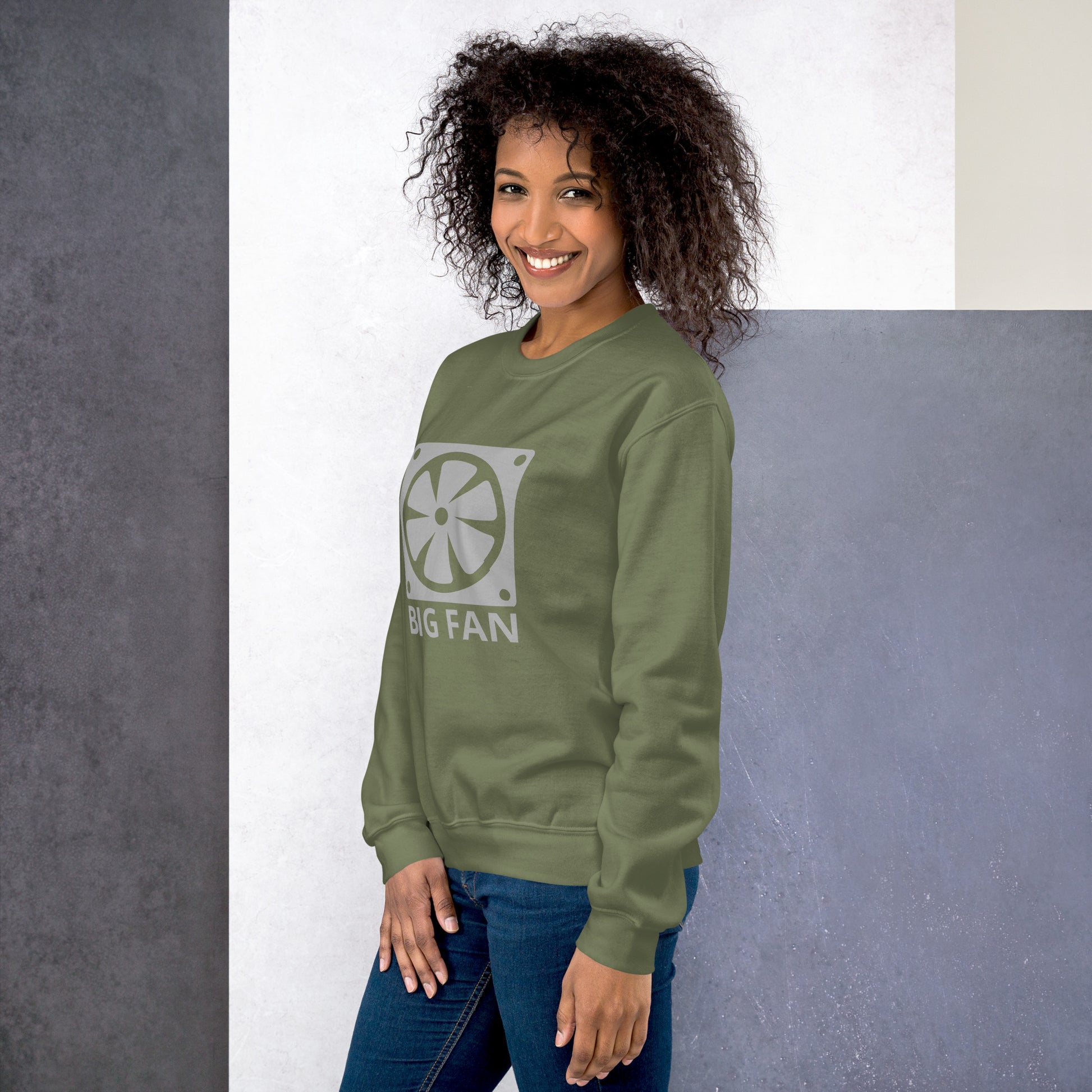 Women with military green sweatshirt with image of a big computer fan and the text "BIG FAN"