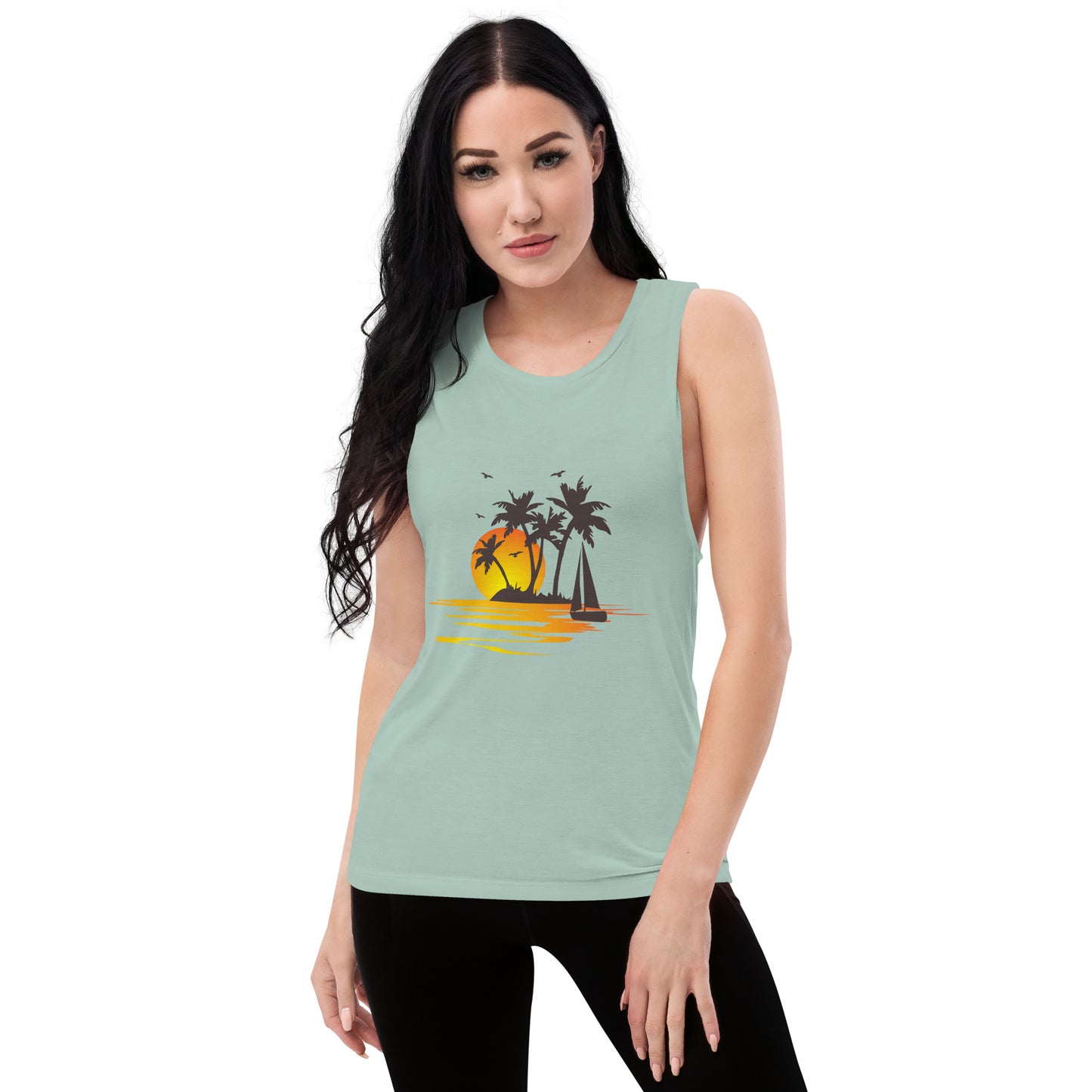 Women with dusty blue muscle tank with a picture of sunset, palm trees and sailboat