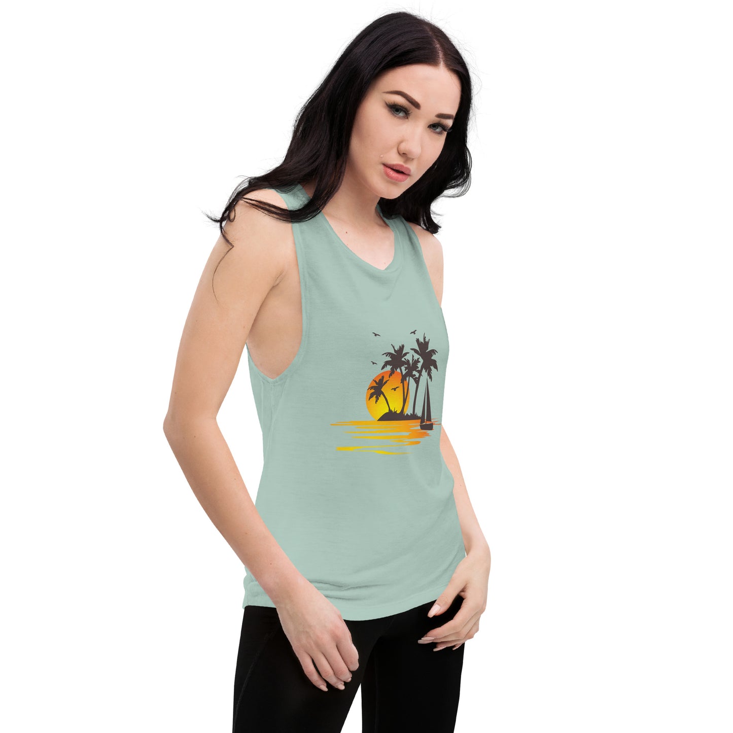 Women with dusty blue muscle tank with a picture of sunset, palm trees and sailboat