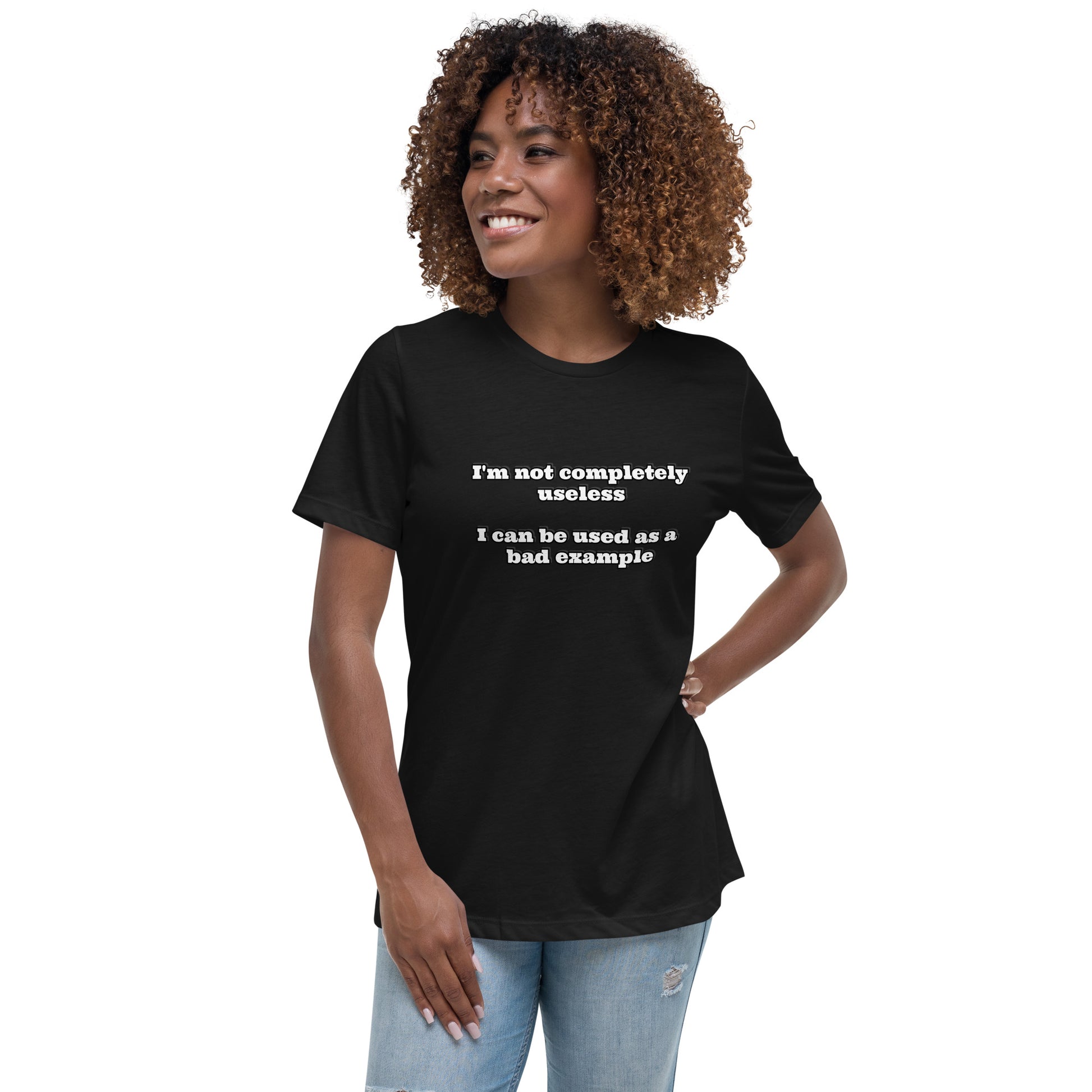 Women with dark grey t-shirt with text “I'm not completely useless I can be used as a bad example”