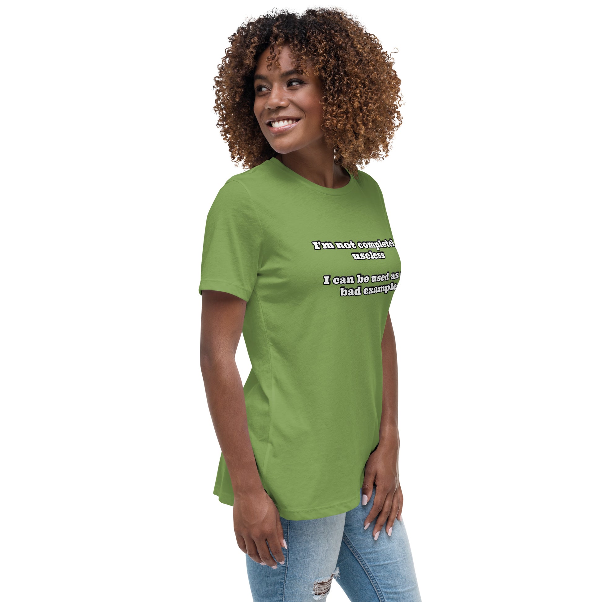 Women with leaf green t-shirt with text “I'm not completely useless I can be used as a bad example”